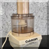 K05. Cuisinart food processor with accessories. - $20 